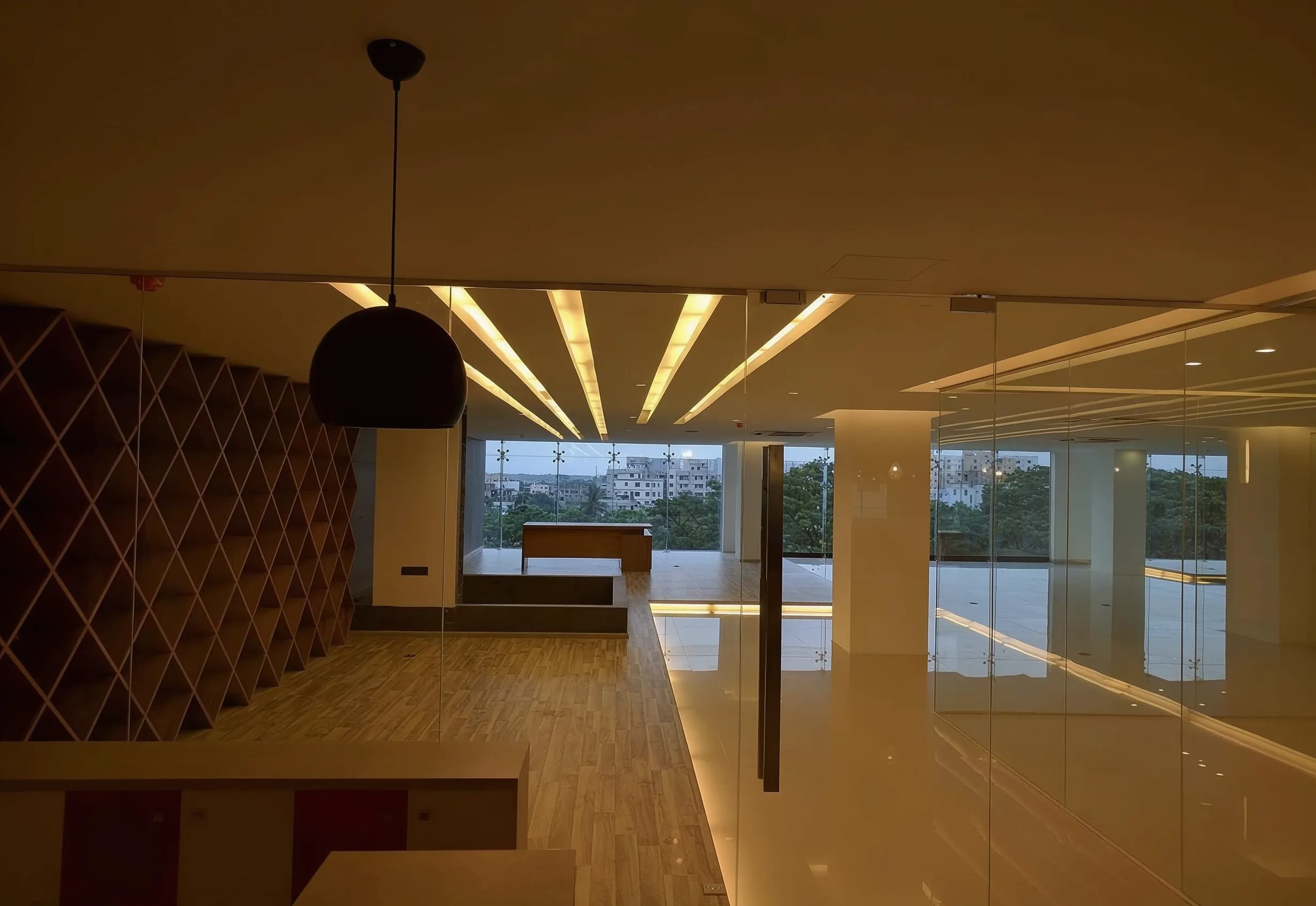 Executive desk and frameless glass partition