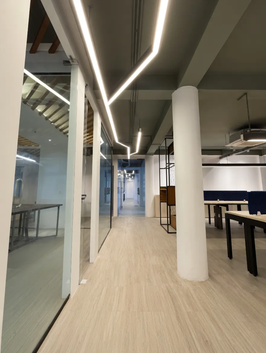 Warm oak ceiling and custom linear LED layout