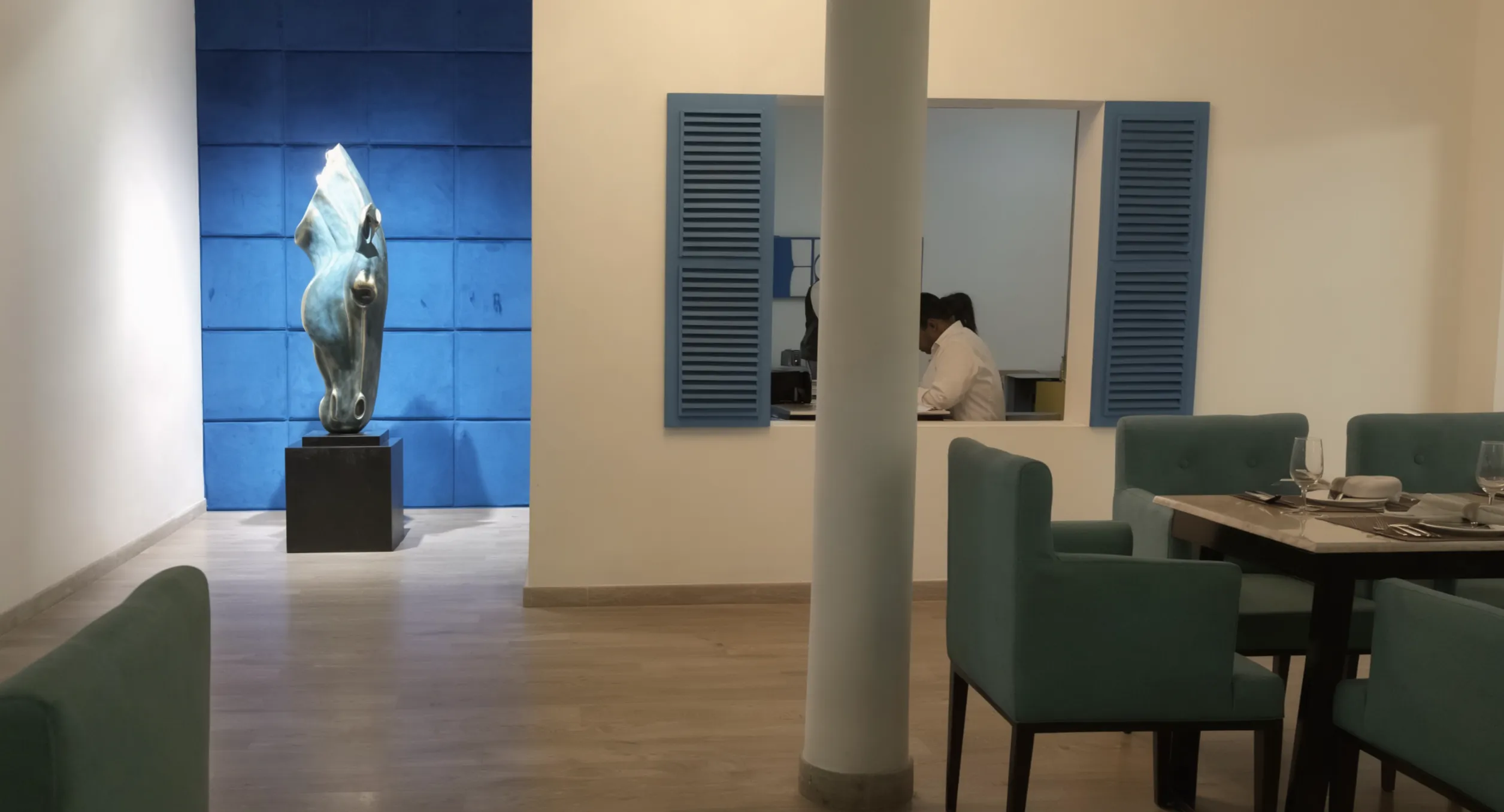 Santorini-inspired white plaster and blue beam layout