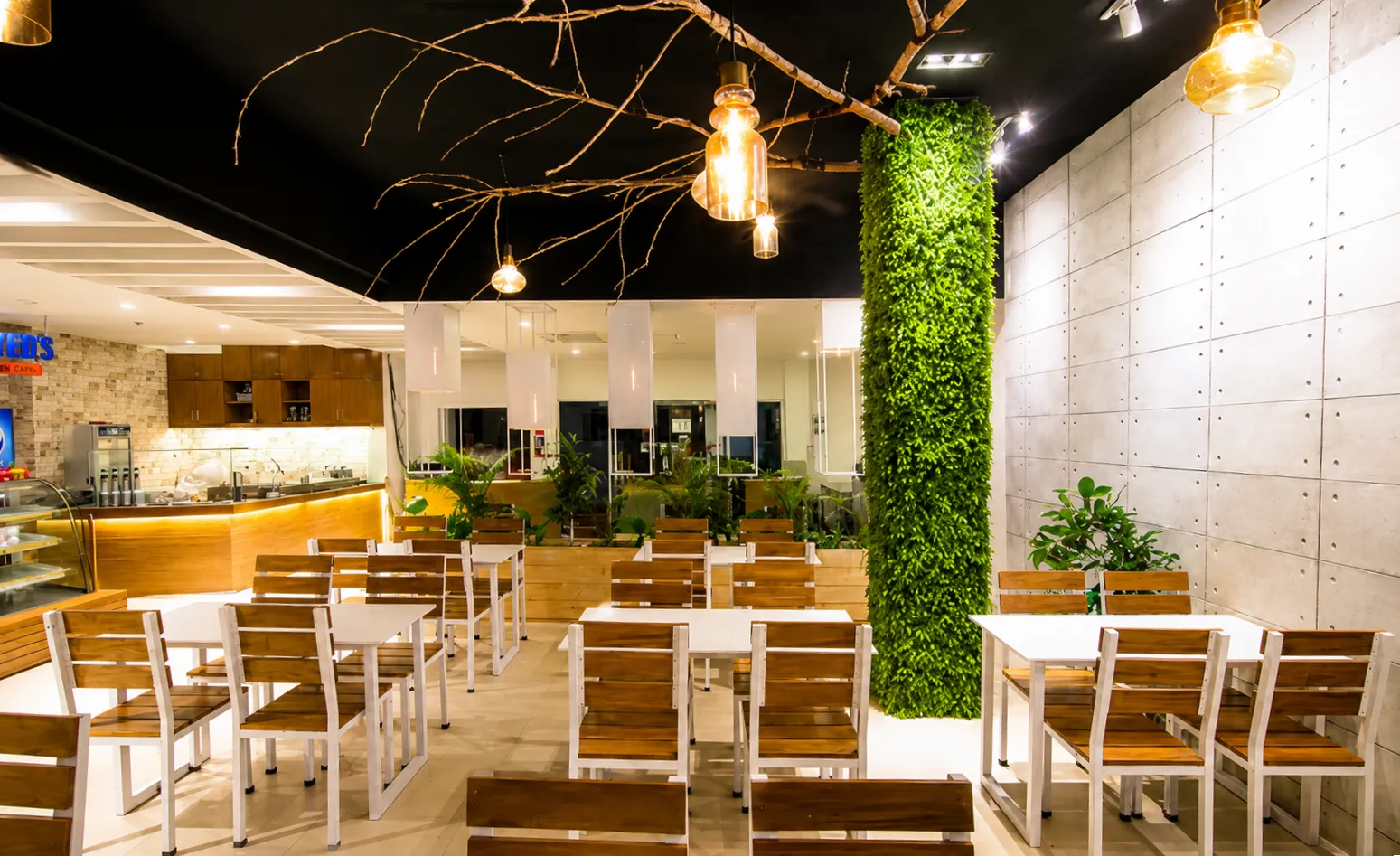 Biophilic bakery interior hanging branch display