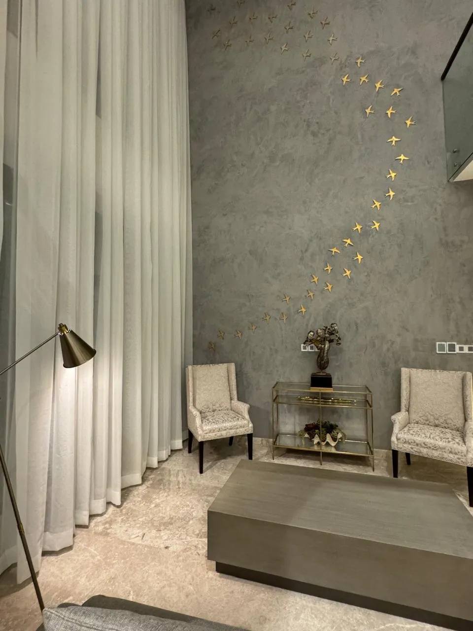 Family lounge split-stone fireplace focal point